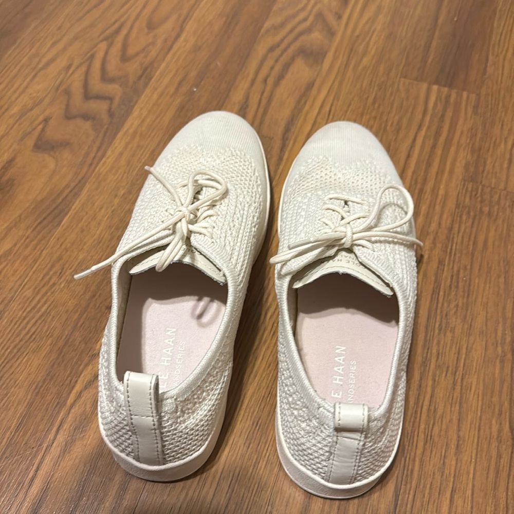 Cole Haan Cream Sneakers with Textured Fabric and Lace-Up Design